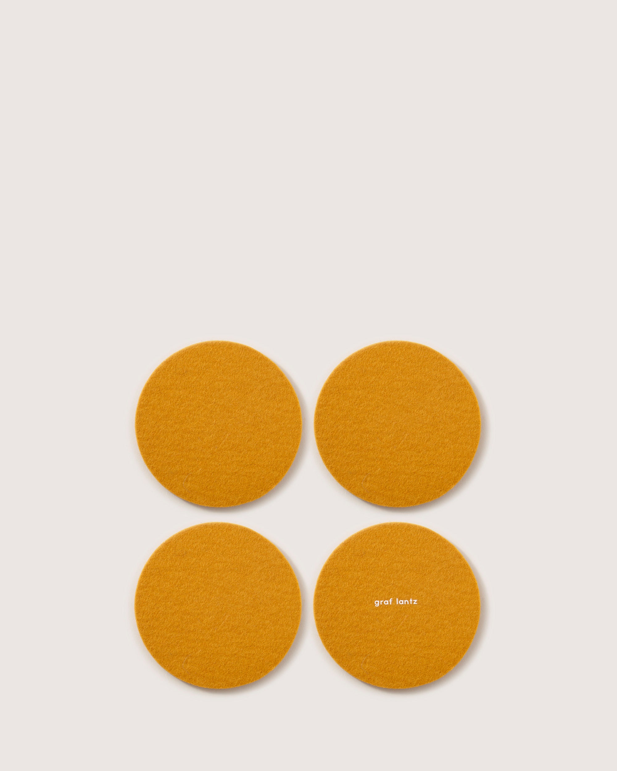 Kobon Leather/Merino Wool Round Tray 4 Pack Coaster Set