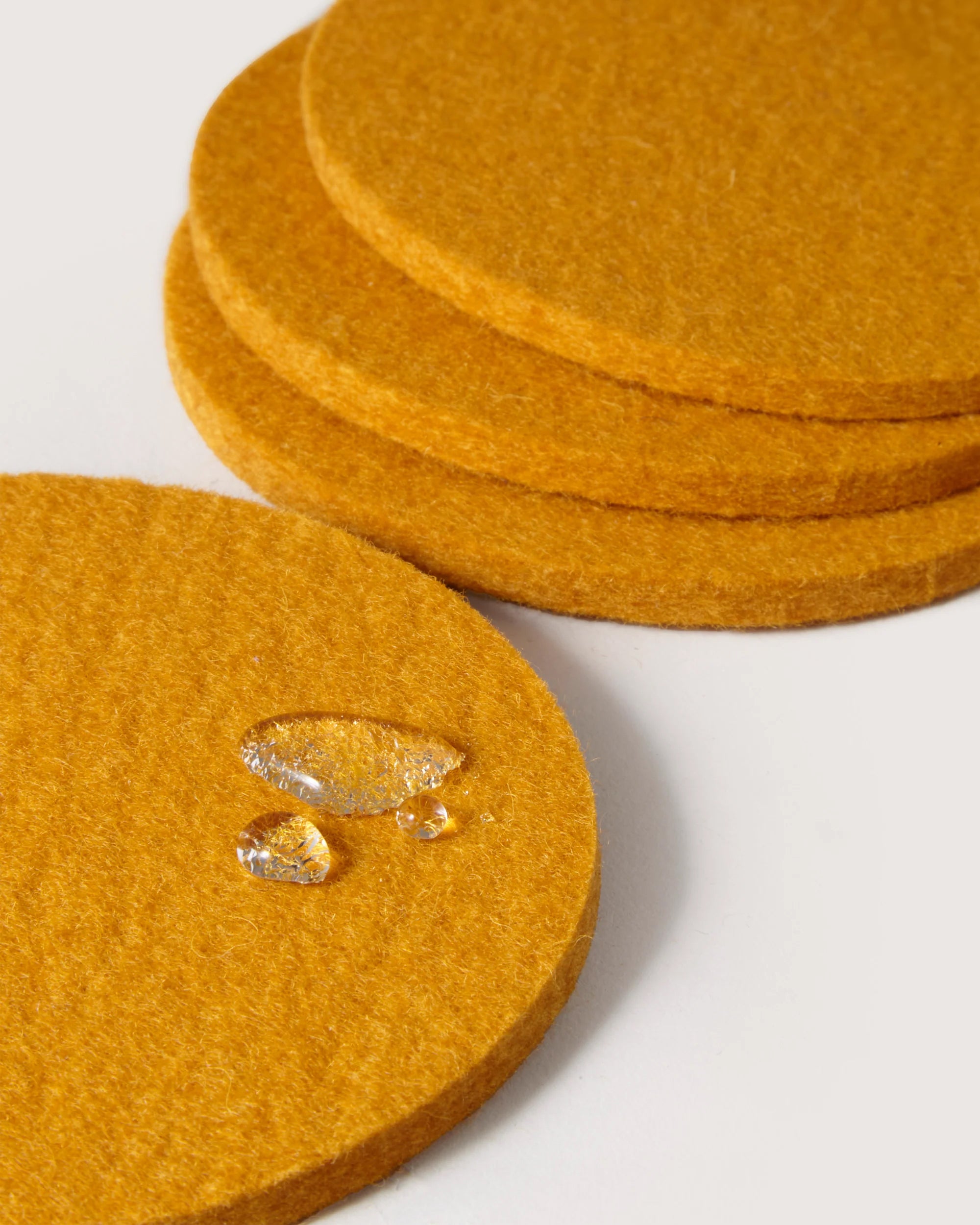 Kobon Leather/Merino Wool Round Tray 4 Pack Coaster Set