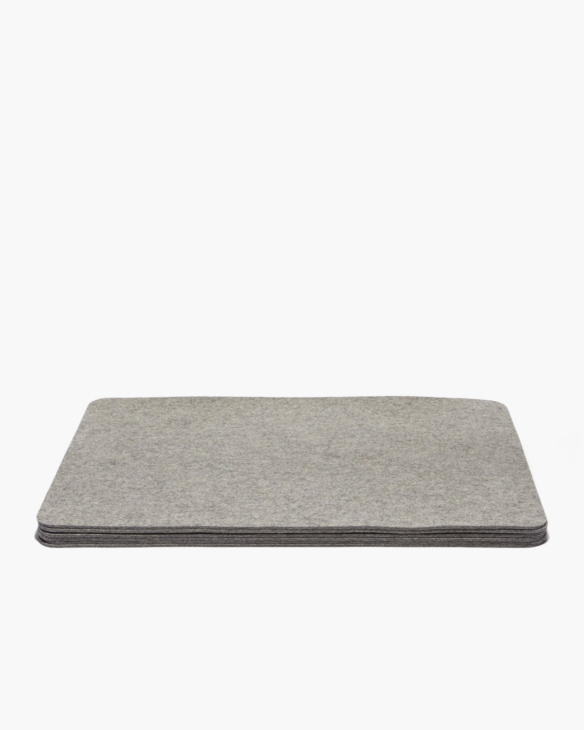 A stack of gray rectangular felt pads from graf lantz evokes a designer-inspired look against a white background.