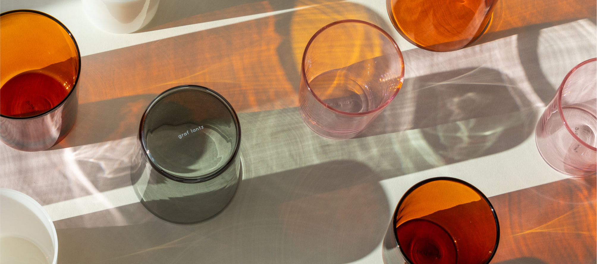 A selection of borosilicate drinking glasses in different colors 